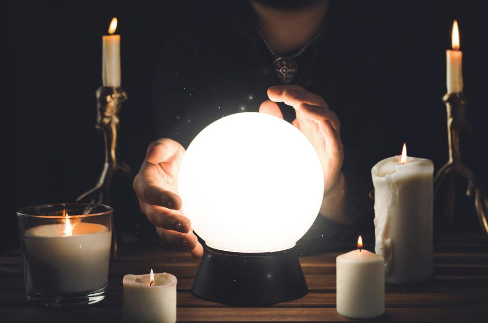 Divination from a crystal ball illustrating clairvoyance abilities.