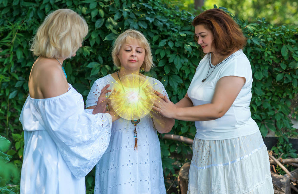 ower of three women, mystical atmosphere playing with Wicca energy white magic.
