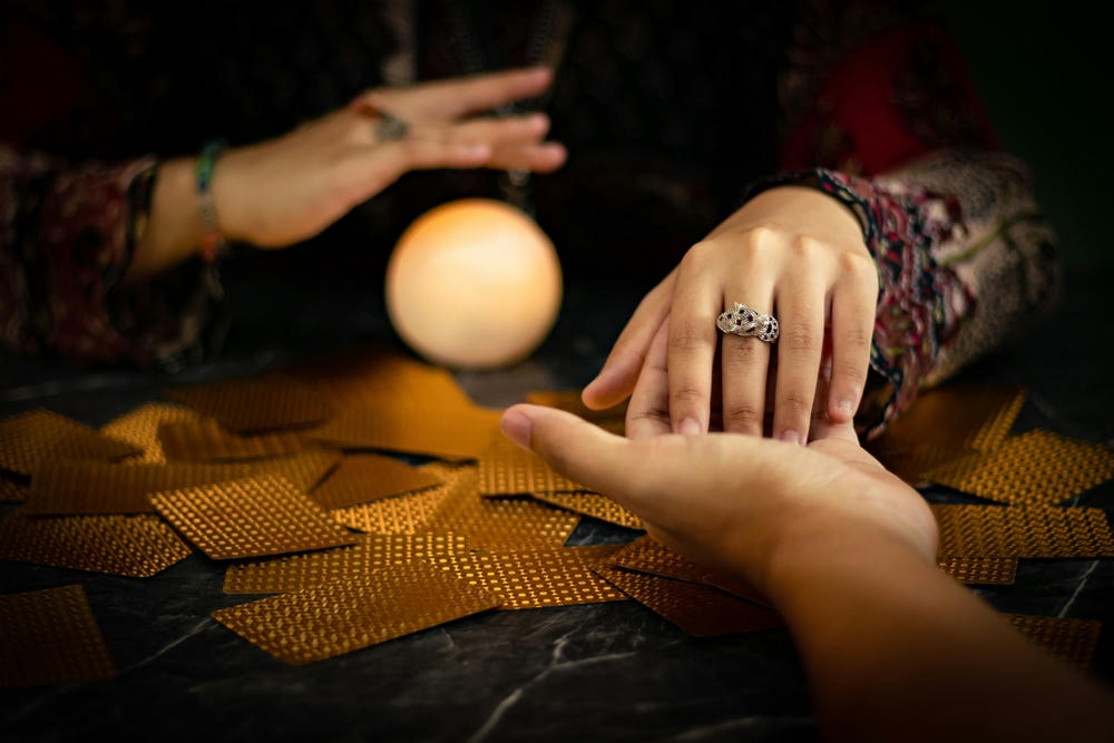 Closer to fortune telling in the ritual of a gipsy fortune teller.