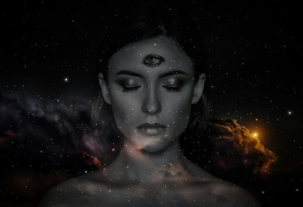 Woman with the third eye on her head showing a supernatural sense concept.